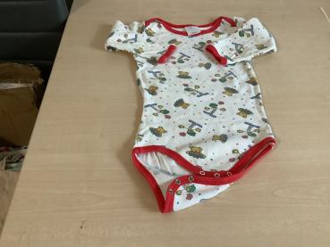 Bunt bedruckter Babybody mit roten Akzenten